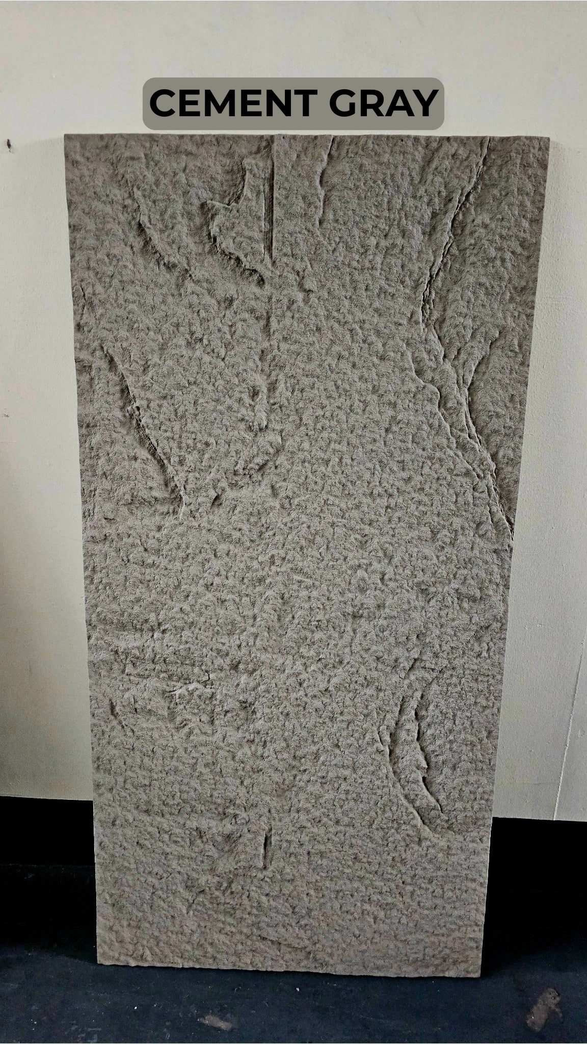 Cement gray textured panel with embossed patterns on a white background